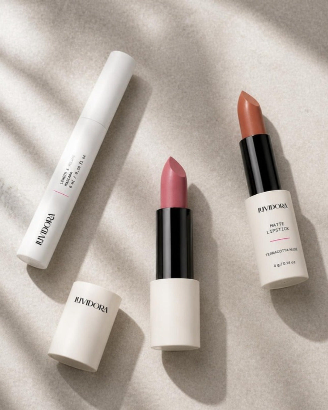 Luvidora dusty rose lipstick with terracotta nude lipstick and mascara