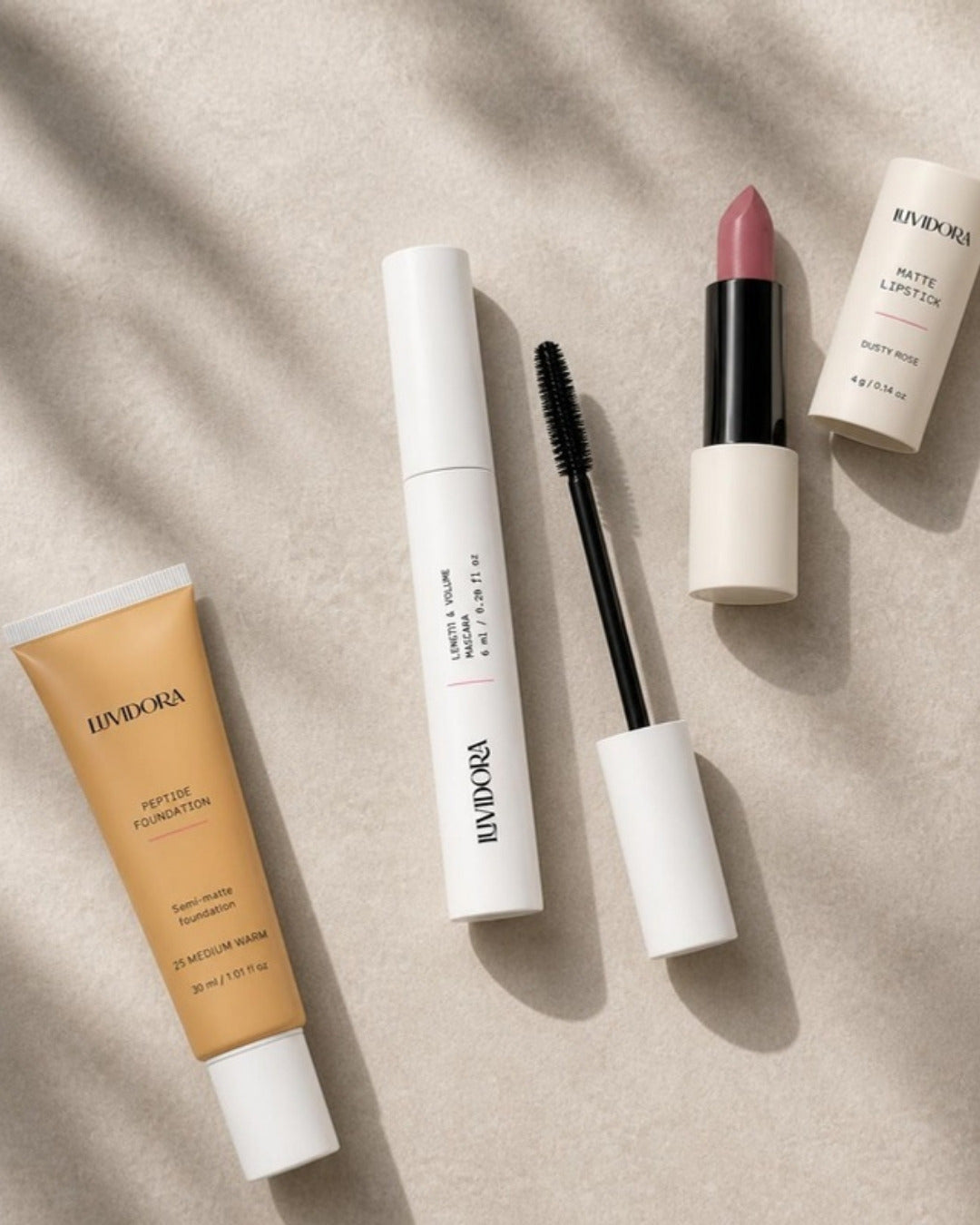 Luvidora mascara with peptide foundation and dusty rose lipstick